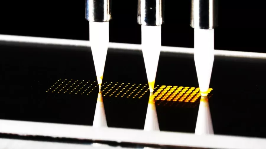 contact spotting of a high density array on a glass slide with different sizes of pins using a pin spotter