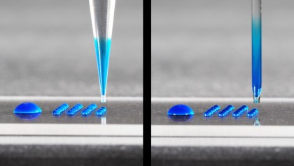 nanolitre dispener with a disposable plastic tip and a glass tip aspirating and dispensing liquid